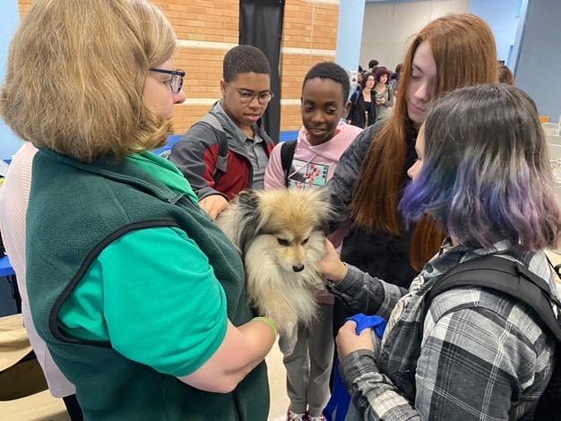 AIR 1 Students at Millstone high school visit with an Attitudes in Reverse therapy dog. (Courtesy Attitudes in Reverse)