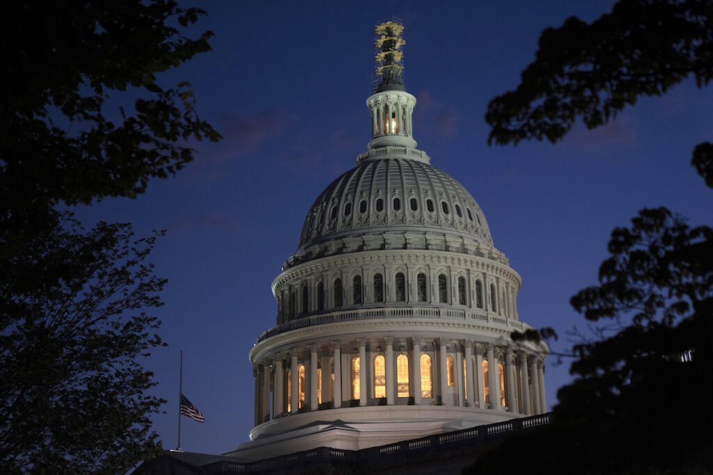 Night falls on the dome of the Capitol in Washington.