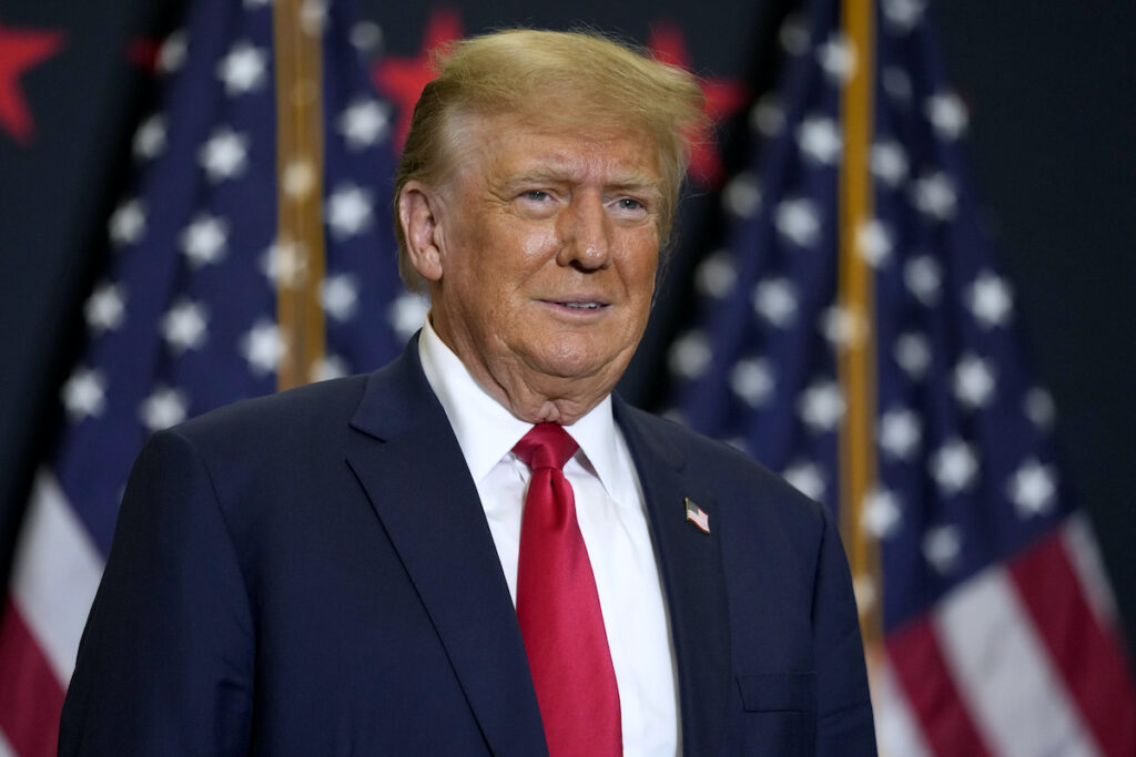 Election 2024 Trump Insurrection Amendment Former President Donald Trump speaks during a commit to caucus rally, Dec. 19, 2023, in Waterloo, Iowa.