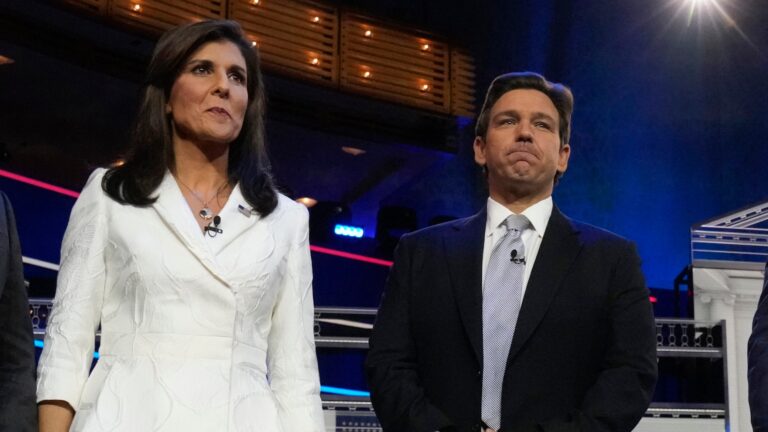 Republican presidential candidates former UN Ambassador Nikki Haley and Florida Gov. Ron DeSantis stand on stage before a Republican presidential primary debate hosted by NBC News Wednesday, Nov. 8, 2023, at the Adrienne Arsht Center for the Performing Arts of Miami-Dade County in Miami. (AP Photo/Wilfredo Lee)