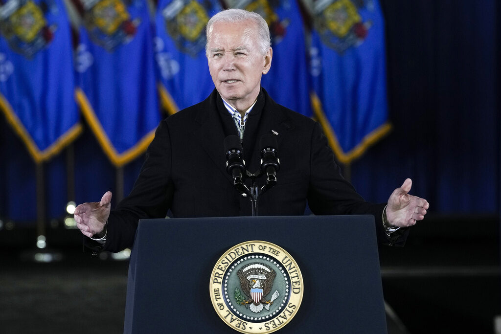 President Joe Biden speaks at a podium