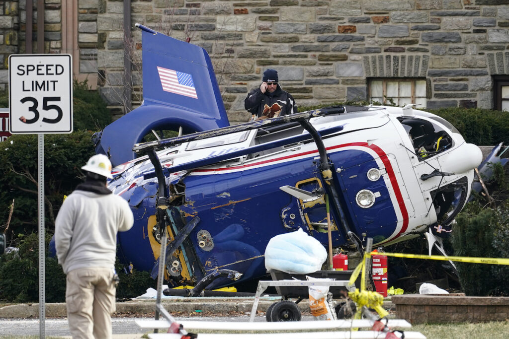 File photo: A medical helicopter rests next to the Drexel Hill United Methodist Church after it crashed the day before in the Drexel Hill section of Upper Darby, Pa., Jan. 12, 2022.