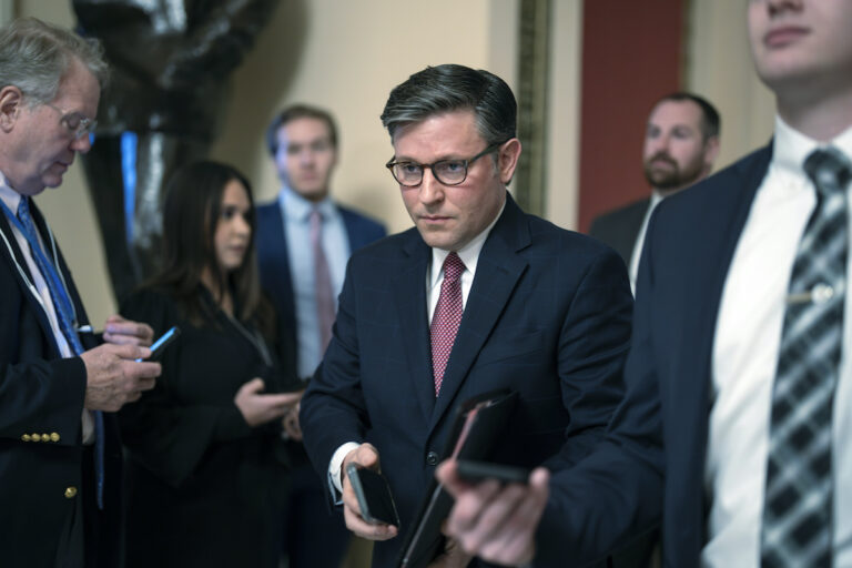 Speaker of the House Mike Johnson, R-La., heads to the chamber at the Capitol in Washington, Friday, Jan. 12, 2024.