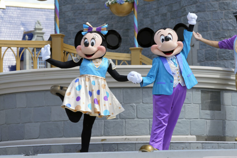 File photo: Minnie and Mickey Mouse perform for guests during a musical show in the Magic Kingdom at Walt Disney World, July 14, 2023, in Lake Buena Vista, Fla. Disney has requested a second court delay in its legal battle with Florida Gov. Ron DeSantis’ appointees over who controls Walt Disney World’s governing district. The request this week comes as the company is accusing the appointees and the governor’s office of failing to produce documents it had requested as part of the litigation. (AP Photo/John Raoux, File)