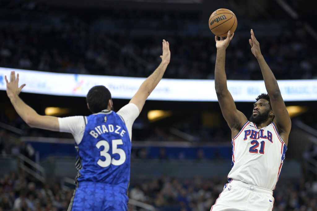 Joel EmbiidGoga Bitadze Philadelphia 76ers center Joel Embiid (21) shoots in front of Orlando Magic center Goga Bitadze (35) during the first half of an NBA basketball game, Friday, Jan. 19, 2024, in Orlando, Fla. (AP Photo/Phelan M. Ebenhack)