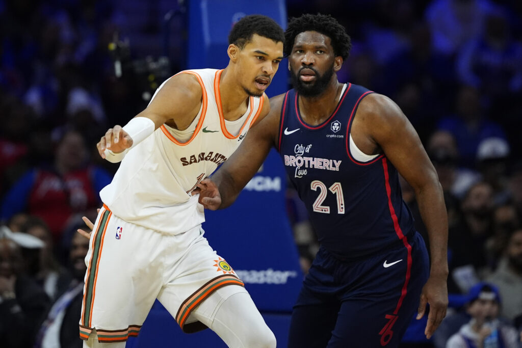 San Antonio Spurs' Victor Wembanyama (left) and Philadelphia 76ers' Joel Embiid struggle for position during the first half of an NBA basketball game, Monday, Jan. 22, 2024, in Philadelphia. (AP Photo/Matt Slocum)
