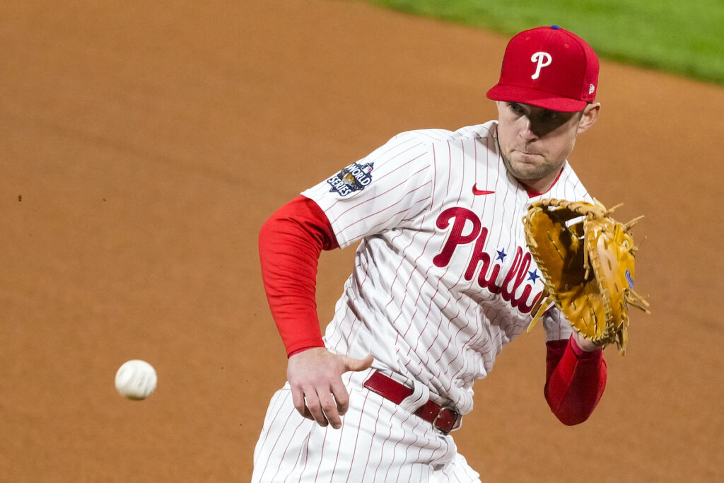 Brewers Hoskins Baseball File photo: Philadelphia Phillies first baseman Rhys Hoskins fields a Houston Astros grounder during Game 3 of baseball's World Series, Nov. 1, 2022, in Philadelphia.