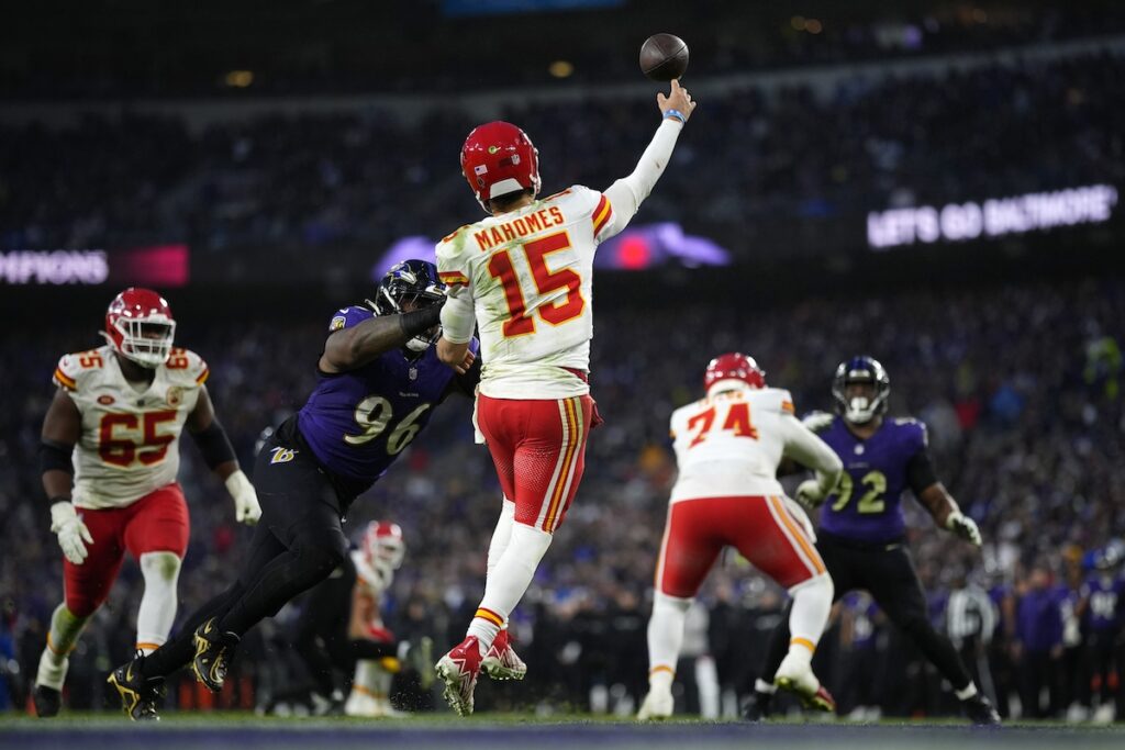 Ravens Chiefs Football Kansas City Chiefs quarterback Patrick Mahomes (15) passes under pressure from Baltimore Ravens defensive tackle Broderick Washington (96) during the second half of the AFC Championship NFL football game, Sunday, Jan. 28, 2024, in Baltimore.