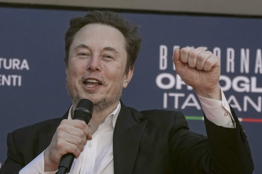 Tesla Musk Compensation Lawsuit File photo: Tesla CEO Elon Musk waves as he arrives at the annual political festival Atreju, organized by the Giorgia Meloni's Brothers of Italy political party, in Rome, Dec. 16, 2023.