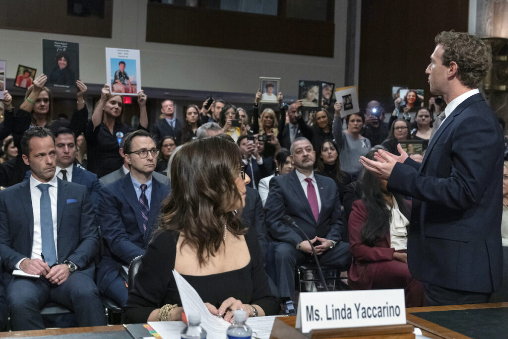 Meta CEO Mark Zuckerberg turns to address the audience during a Senate Judiciary Committee hearing on Capitol Hill in Washington, Wednesday, Jan. 31, 2024, to discuss child safety. X CEO Linda Yaccarino watches at left.