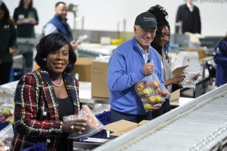Joe Biden and Cherelle Parker working at the food bank together