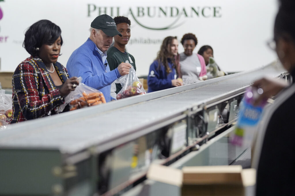 Joe Biden and Cherelle Parker working at the food bank together