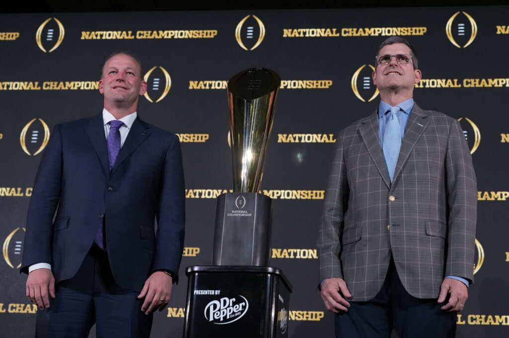 CFP Washington Michigan Football Washington head coach Kalen DeBoer, left, and Michigan head coach Jim Harbaugh pose with the trophy after a news conference ahead of the national championship NCAA College Football Playoff game between Washington and Michigan on Sunday, Jan. 7, 2024, in Houston. The game will be played Monday.
(Godofredo A. Vasquez/AP)