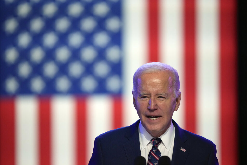 Election 2024 Biden President Joe Biden speaks in front of a U.S. flag