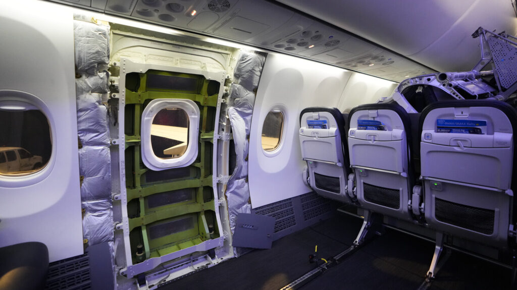 Boeing Emergency Landing The door plug area of an Alaska Airlines Boeing 737 Max 9 aircraft, seen with the paneling removed, awaits inspection