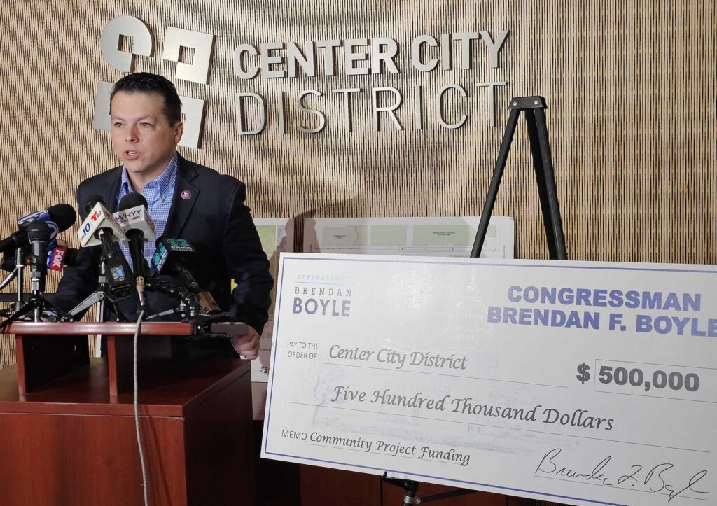 brendan-boyle-t-macdonald-2024-01-29 Brendan Boyle speaking a podium, with a giant check