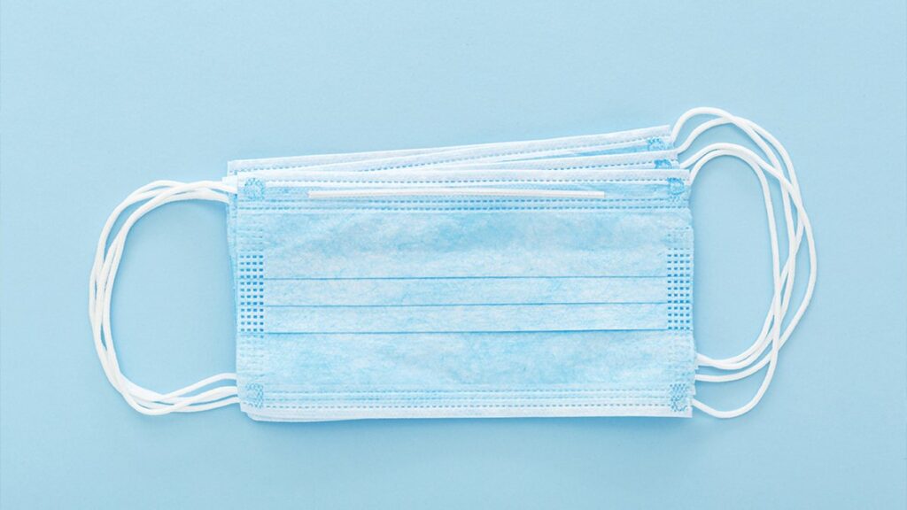 Face masks against a blue background