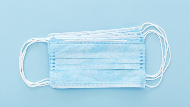 Face masks against a blue background