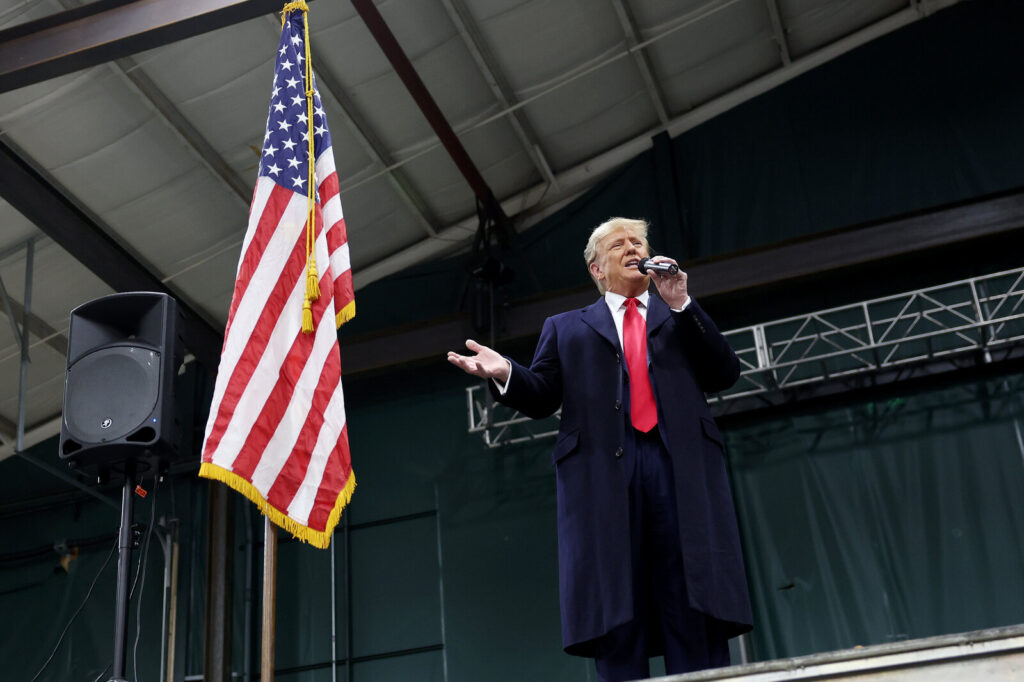 Iowa Holds Republican Caucuses For First In The Nation Presidential Nominating Contest DES MOINES, IOWA - JANUARY 15: Former president Donald Trump speaks to voters during a visit to a caucus site at the Horizon Event Center on January 15, 2024 in Clive, Iowa. Iowans vote today in the state’s caucuses for the first contest in the 2024 Republican presidential nominating process. (Photo by Kevin Dietsch/Getty Images)