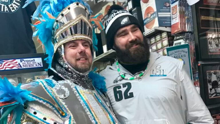 Jason Kelce posing with a fan.