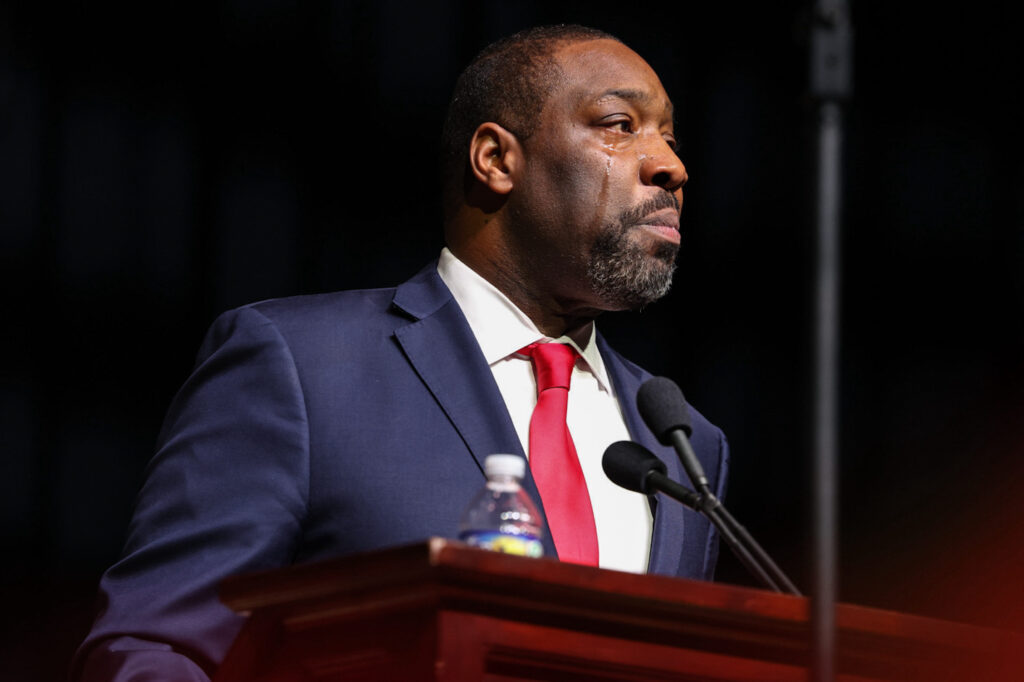 Kenyatta Johnson speaking at a podium.
