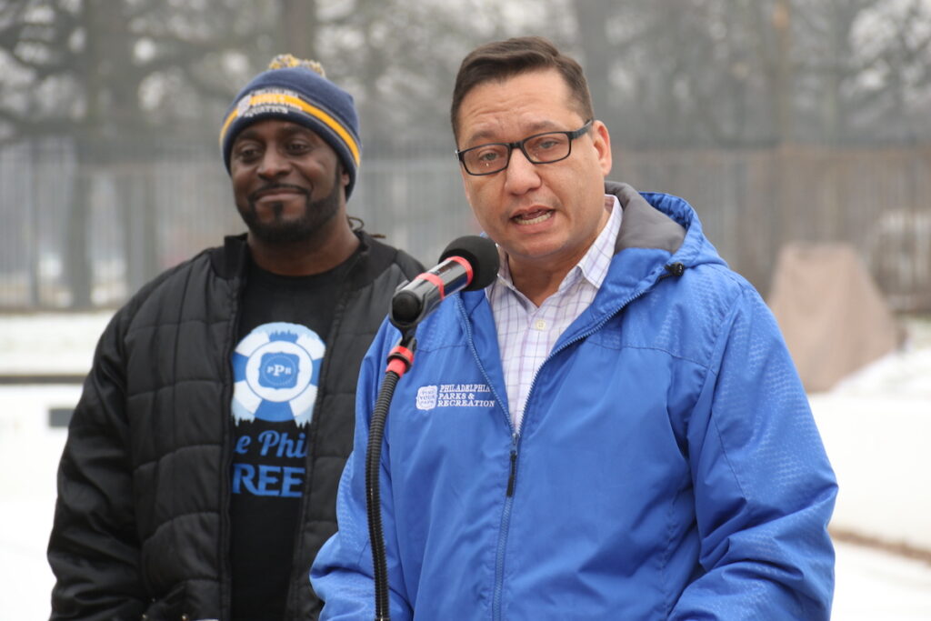 Philadelphia Parks and Recreation Commissioner Anthony Rendon speaks into a microphone