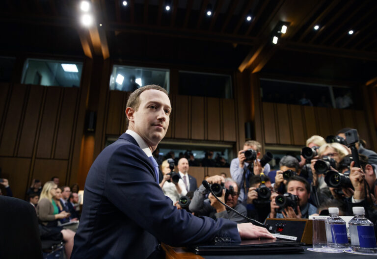 Facebook CEO Mark Zuckerberg arrives to testify before a joint hearing of the Commerce and Judiciary Committees on Capitol Hill in Washington, Tuesday, April 10, 2018, about the use of Facebook data to target American voters in the 2016 election. (AP Photo/Carolyn Kaster)
