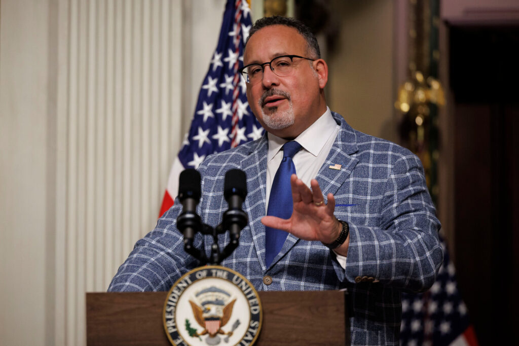Vice President Harris Swears In President’s Advisory Commission U.S. Education Secretary Miguel Cardona speaks at a podium