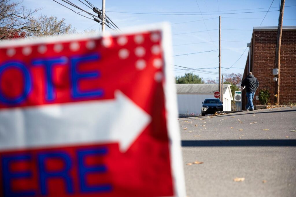 vote-here-spotlight-pa-2024-01-17 VOTE HERE sign at a polling place