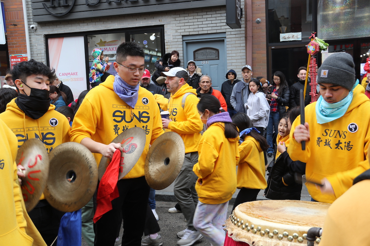 Drums and cymbals provided a rhythm for the lions to dance with on Sunday for the Lunar New Year Parade in Chinatown. (Cory Sharber/WHYY)