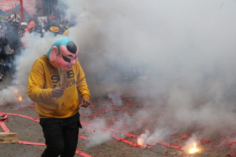 Chinatown was cloaked in the lion's breath during the Lunar New Year Parade on Feb. 11, 2024, celebrating the Year of the Dragon. (Cory Sharber/WHYY)