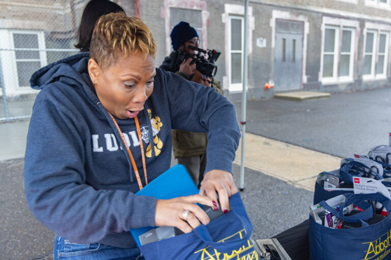Jill Smith, a learning support teacher at the James R. Ludlow School in Philadelphia, reacts with surprise to the electric pencil sharpener in a bag