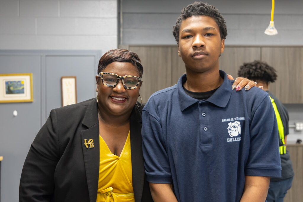 Dr. Nyshawana Francis-Thomspon posing for a photo with a student