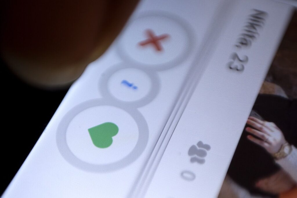 A man uses the dating app Tinder in New Delhi. (AP Photo/Tsering Topgyal, File)