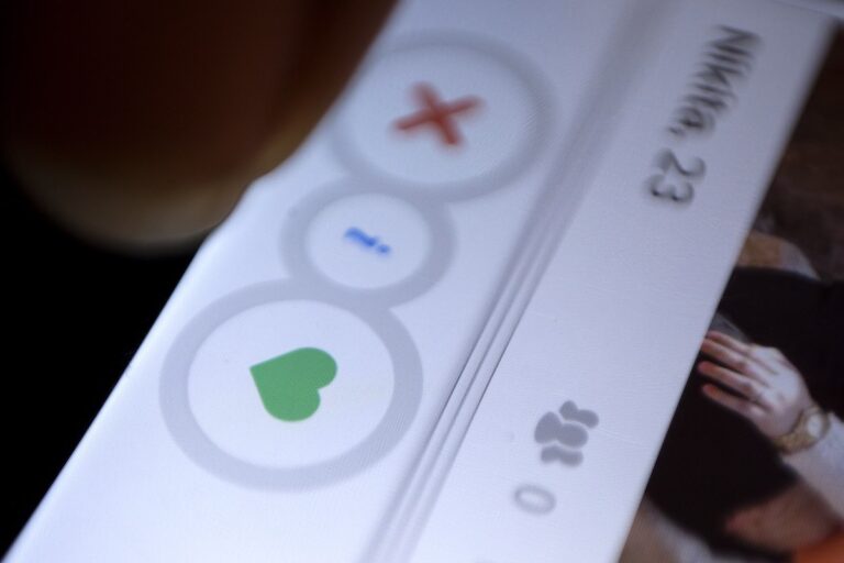 A man uses the dating app Tinder in New Delhi. (AP Photo/Tsering Topgyal, File)