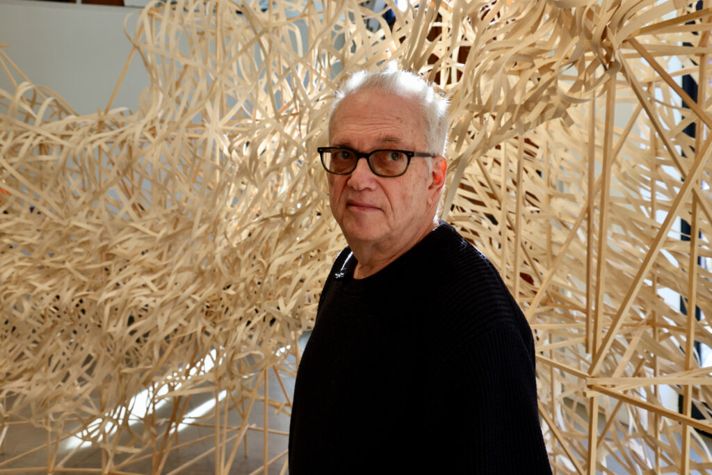 2024 02 07-e lee-stephen talasnik-philadelphia museum for art in wood-floe Artist Stephen Talasnik stands within his sculpture, a glacier made of wood and bamboo
