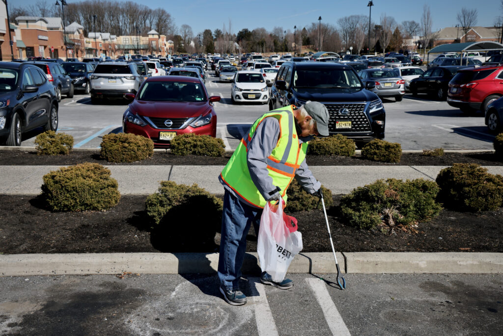 Jim Alturo picking up trash