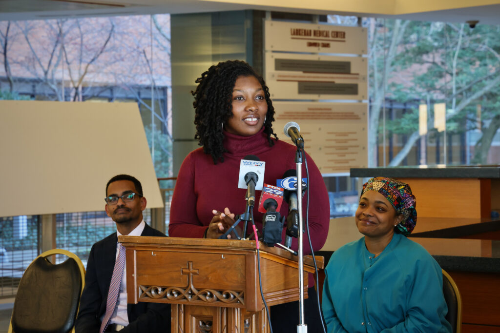Shariah Harris speaks at a podium