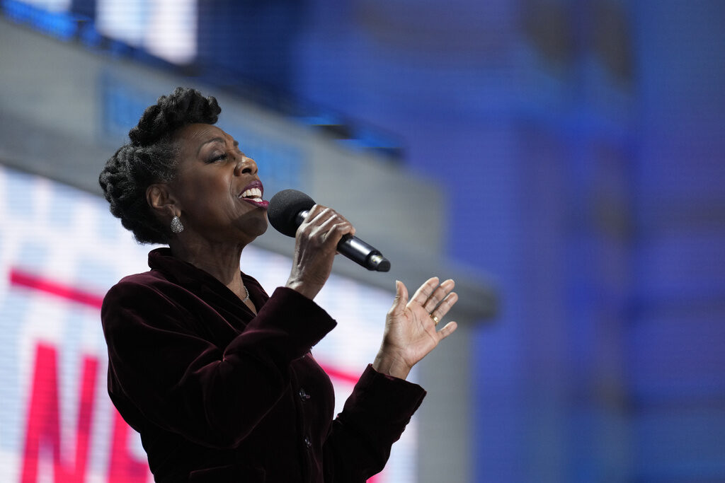 Oleta Adams sings into a microphone