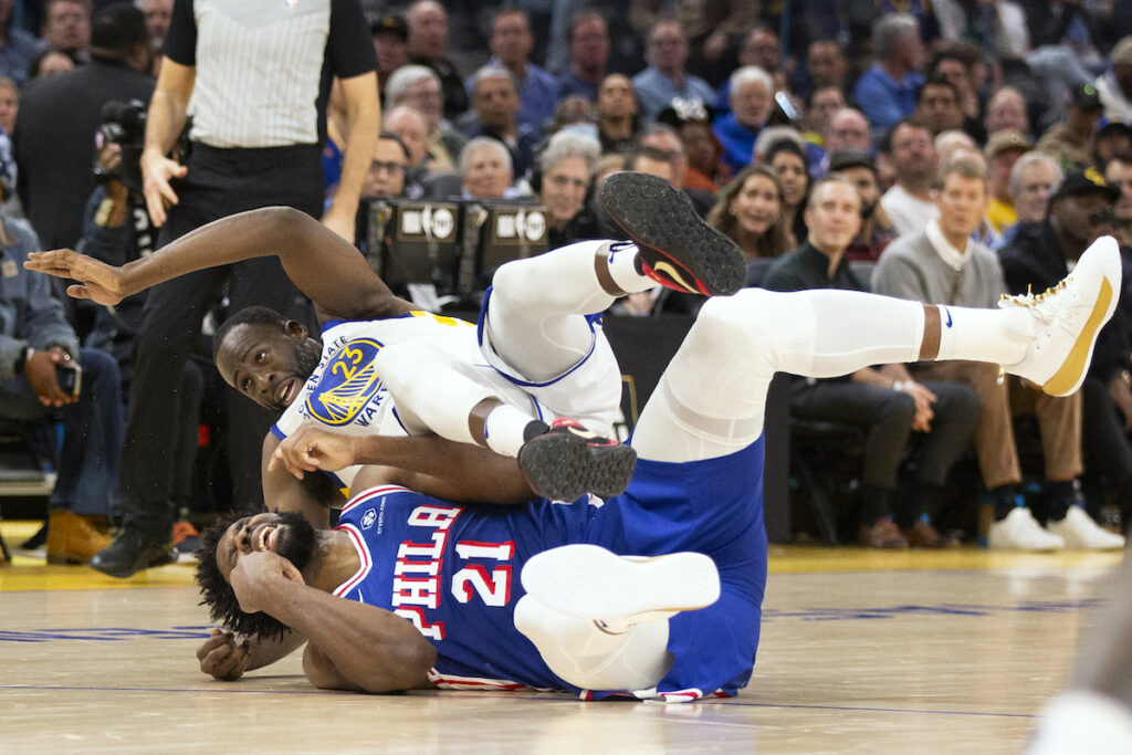 Draymond GreenJoel Embiid Golden State Warriors forward Draymond Green (23) falls over Philadelphia 76ers center Joel Embiid (21) on an offensive foul by Embiid during the first half of an NBA basketball game, Tuesday, Jan. 30, 2024, in San Francisco.