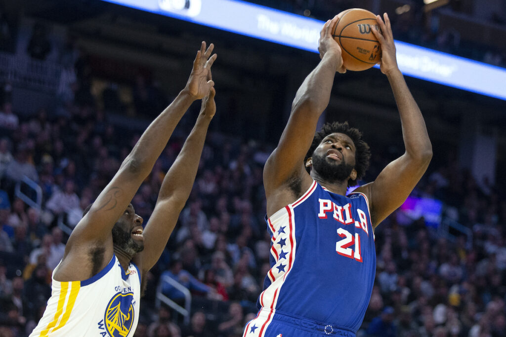 Joel EmbiidDraymond Green Philadelphia 76ers center Joel Embiid (21) shoots over Golden State Warriors forward Draymond Green (23) during the first half of an NBA basketball game, Tuesday, Jan. 30, 2024, in San Francisco.