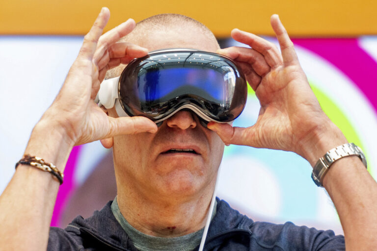 Scott Joachim tries out an Apple Vision Pro headset during the first day of sales at a Palo Alto, Calif., Apple store on Friday, Feb. 2, 2024. (AP Photo/Noah Berger)
