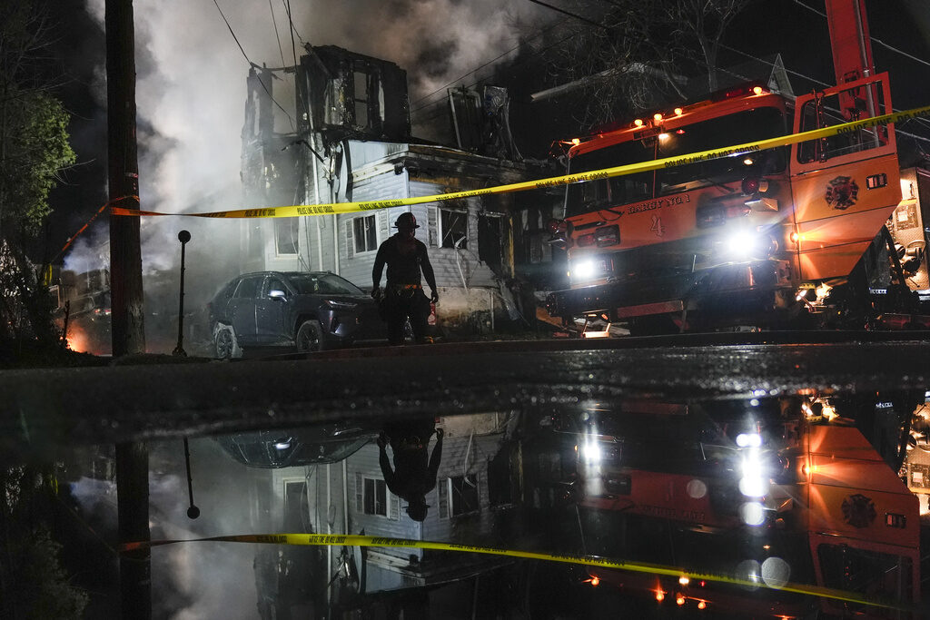 APTOPIX Officers Wounded House Fire Firefighters work at the scene in East Lansdowne