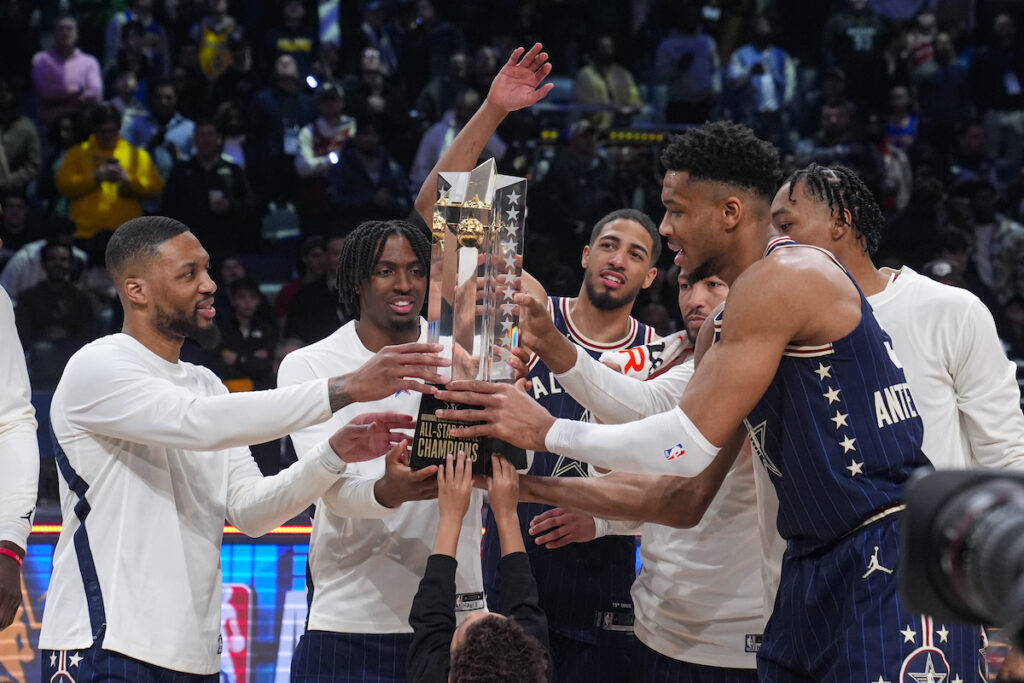 All Star Game Basketball The East team, lead by captain Milwaukee Bucks forward Giannis Antetokounmpo (right) hoists the trophy after defeating the West 211-186 in the NBA All-Star basketball game in Indianapolis, Sunday, Feb. 18, 2024. (AP Photo/Darron Cummings)