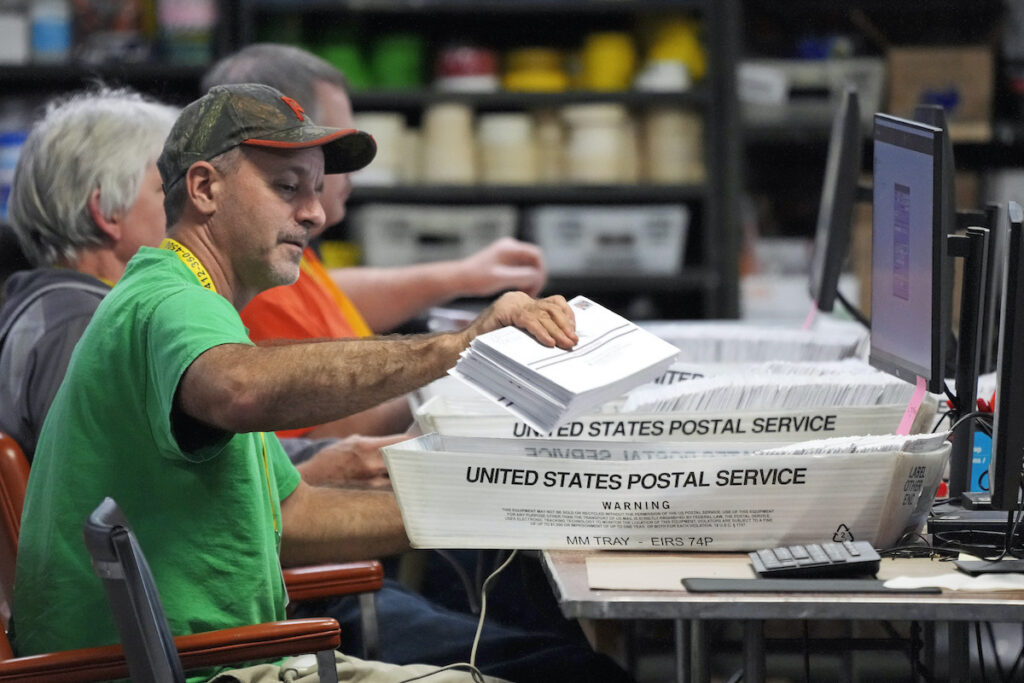 Pennsylvania Elections Mail Ballots File photo: Allegheny County workers scan mail-in and absentee ballots at the Allegheny County Election Division Elections warehouse in Pittsburgh, Thursday, Nov. 3, 2022.