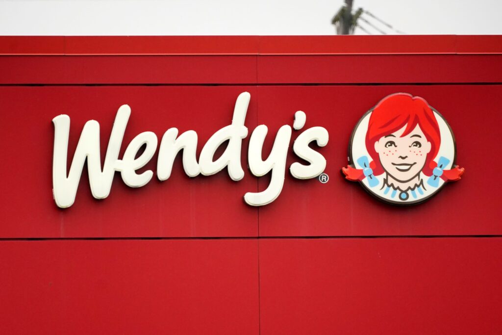 A sign advertising Wendy's