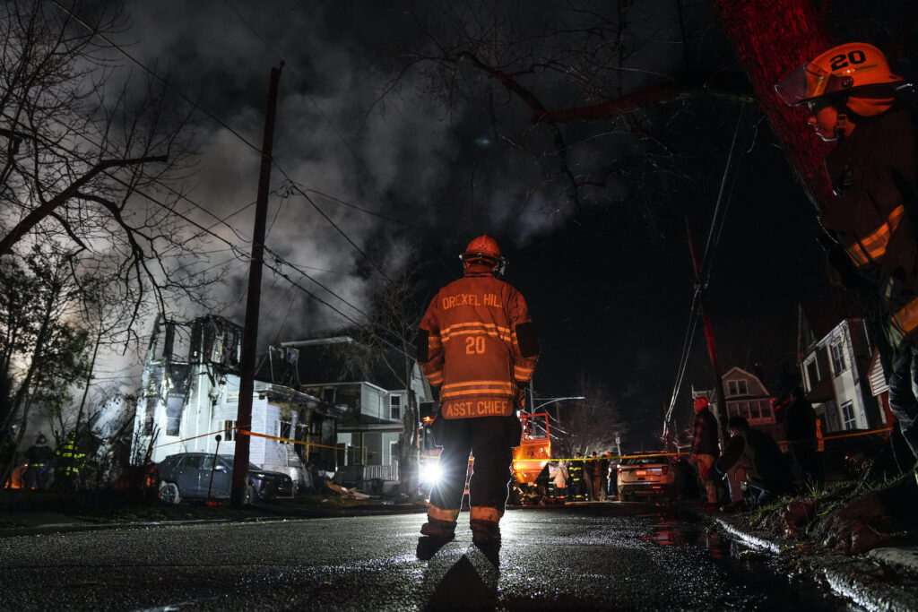 Police at the scene of the fire and shooting