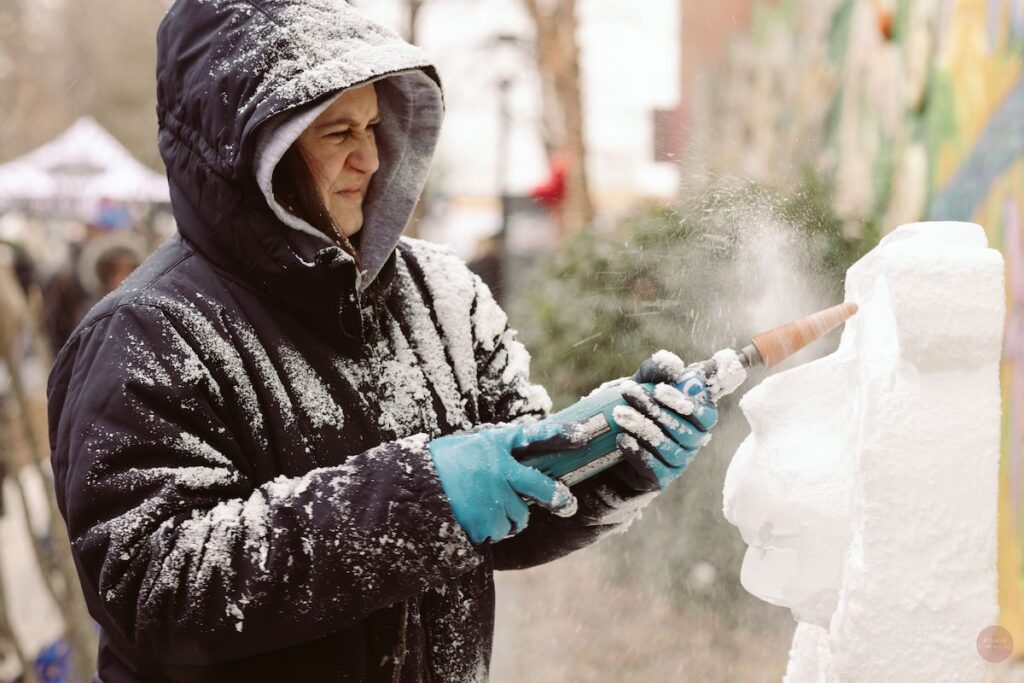 ArcticWonderland1 A person carves an ice sculpture