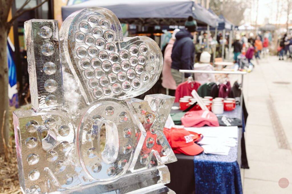 An ice sculpture reads "I love Rox"