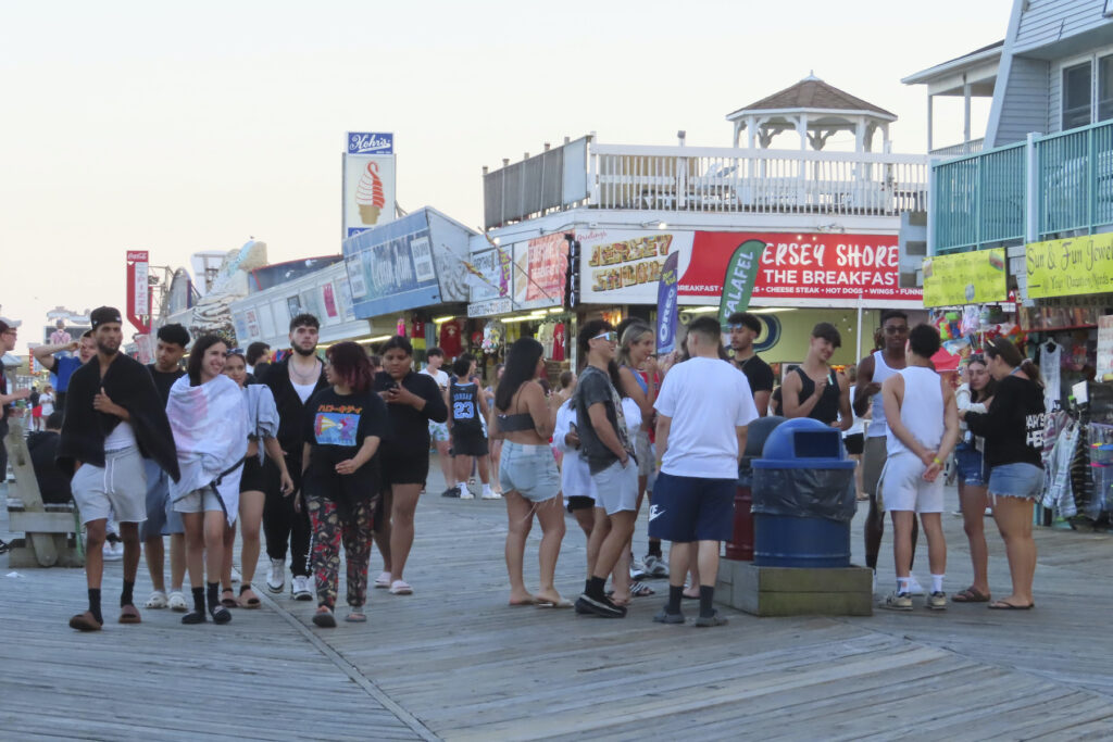 People on the boardwalk at the Jersey Shore